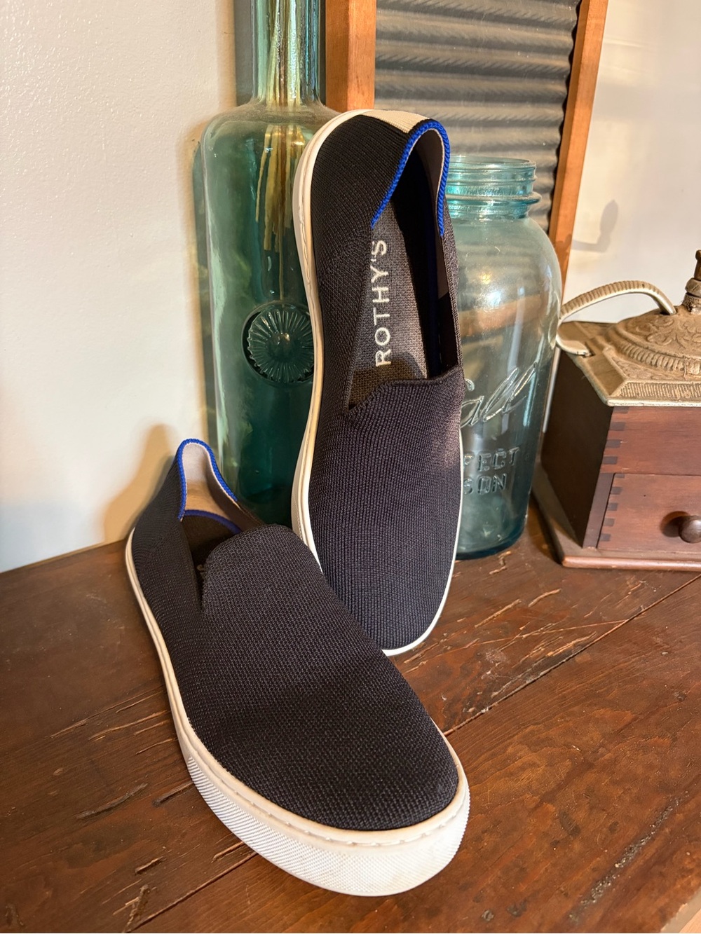 Rothy's Black Knit Slip-On Sneakers with Blue Trim
